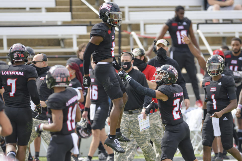 Louisiana-Lafayette safety Percy Butler (9) celebrates an interception next to Louisiana-Lafayette head coach Billy Napier during an NCAA college football game against South Alabama in Lafayette, La., Saturday, Nov. 14, 2020. (AP Photo/Matthew Hinton)