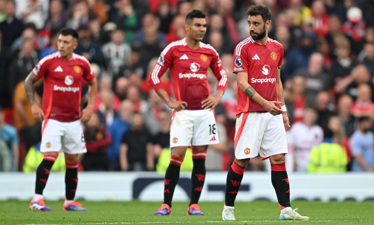 <span>Manchester United players strike a familiar pose in the 3-0 defeat by Liverpool.</span><span>Photograph: Michael Regan/Getty Images</span>