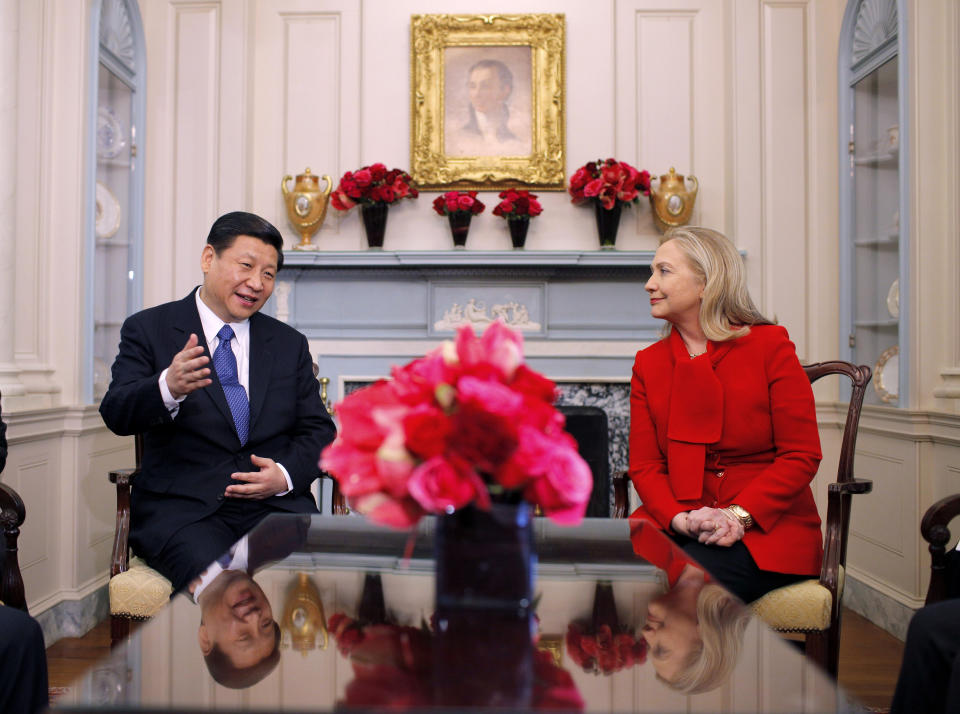FILE - Secretary of State Hillary Rodham Clinton meets with Chinese Vice President Xi Jinping at the State Department in Washington on Feb. 14, 2012. Chinese President Xi Jinping was the son of a communist revolutionary leader, a victim of the Cultural Revolution and a provincial leader who promoted economic growth before ascending to the very top a decade ago. (AP Photo/Charles Dharapak, File)