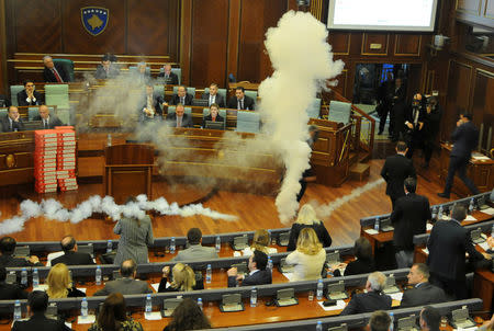 Kosovo opposition politicians release tear gas in parliament to obstruct a session in Pristina, Kosovo March 21, 2018. REUTERS/Laura Hasani