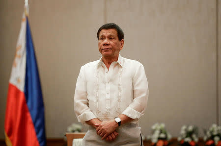 Philippines 'President Rodrigo Duterte stands at attention during a courtesy call with the Association of Southeast Asian Nations (ASEAN) Economic Ministers in Manila, Philippines, September 6, 2017. REUTERS/Pool/Mark Cristino