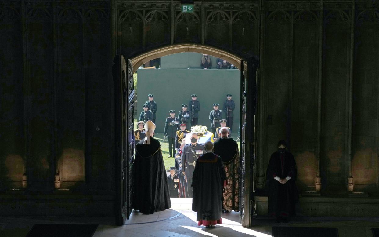 The coffin of the Duke of Edinburgh is carried into his funeral service at St George's Chapel at Windsor Castle - Danny Lawson