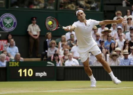 Roger Federer of Switzerland hits a shot during his match against Samuel Groth of Australia at the Wimbledon Tennis Championships in London, July 4, 2015. REUTERS/Henry Browne