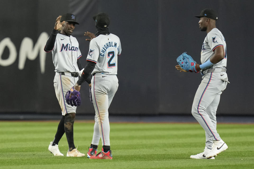 Miami Marlins outfielders Nick Gordon, left, Jazz Chisholm Jr., center, and Jesús Sánchez celebrate after the baseball game against the New York Yankees at Yankee Stadium, Wednesday, April 10, 2024, in New York. The Marlins defeated the Yankees 5-2. (AP Photo/Seth Wenig)