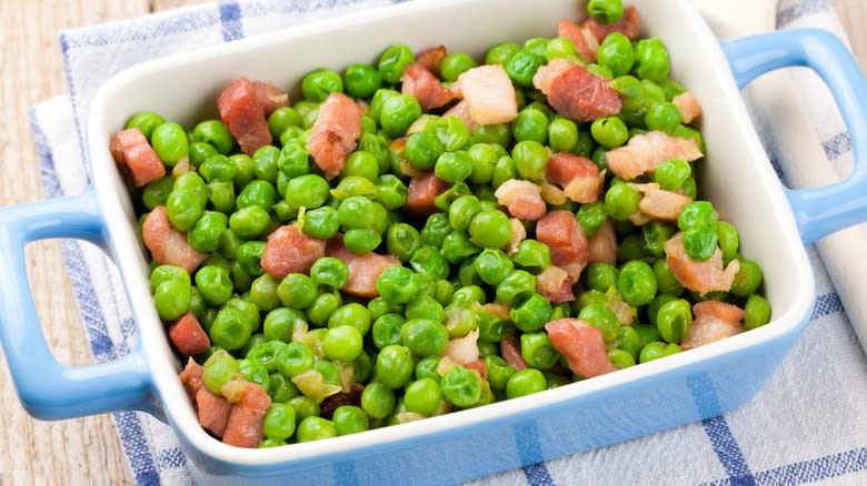 Peas with bacon in dish