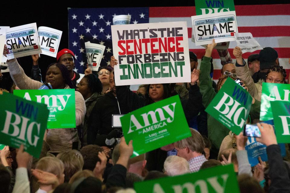 Protestors take over the stage forcing Democratic presidential hopeful Minnesota Senator Amy Klobuchar to cancel her rally before it even started on March 1, 2020 in St. Louis Park, west of Minneapolis, Minnesota. - Hundreds of Klobuchar supporters witnessed a group of Black Lives Matter protesters demanding her to drop out of the race after her misshandling of Myon Burrell's case in 2002 when she was County Attorney. (Photo by Kerem Yucel / AFP) (Photo by KEREM YUCEL/AFP via Getty Images)