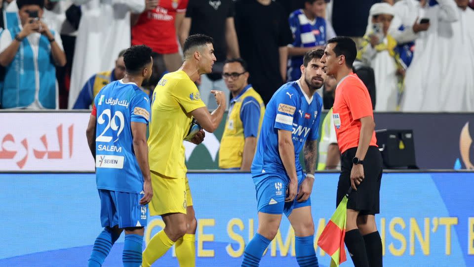 Ronaldo remonstrates with the linesman. - Stringer/Reuters