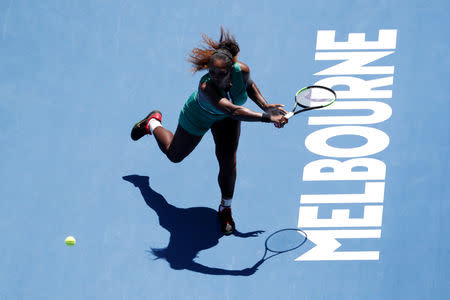 Tennis - Australian Open - Quarter-final - Melbourne Park, Melbourne, Australia, January 23, 2019. Serena Williams of the U.S. in action with Czech Republic's Karolina Pliskova. REUTERS/Kim Kyung-Hoon