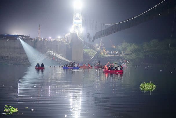 PHOTO: Indian rescue personnel conduct search operations on Oct. 31, 2022 after a bridge across the river Machchhu collapsed in Morbi on Oct. 30. (Sam Panthaky/AFP via Getty Images)