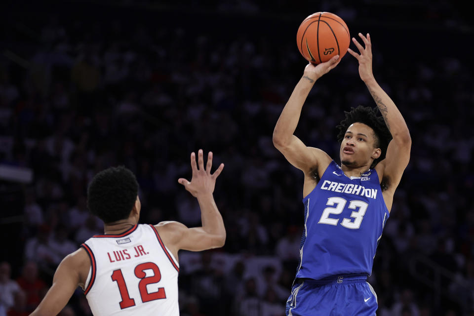 Creighton guard Trey Alexander (23) shoots over St. John's guard RJ Luis Jr. during the first half of an NCAA college basketball game Sunday, Feb. 25, 2024, in New York. (AP Photo/Adam Hunger)