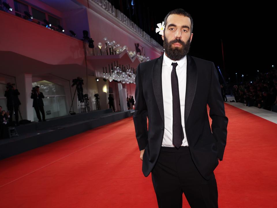 Romain Gavras on the "Athena" red carpet at the 79th Venice International Film Festival.