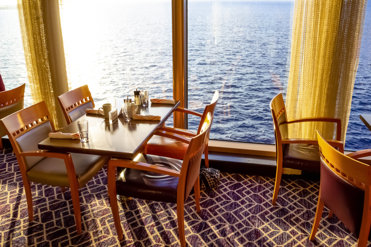 Empty Tables and Chairs in a Cruise Ship Dining Room