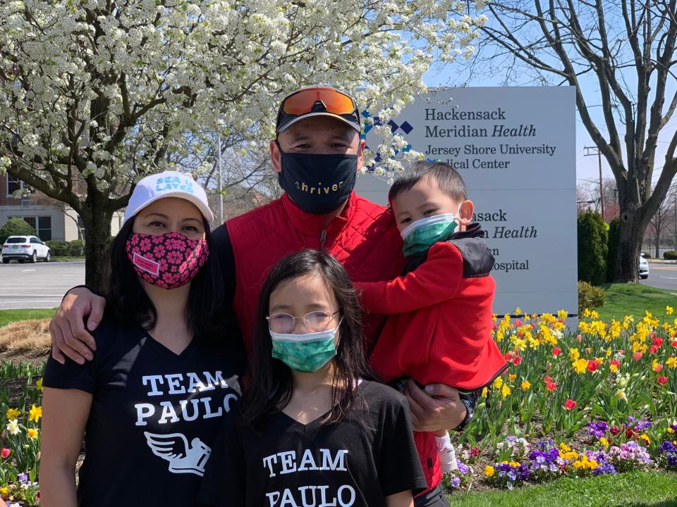 Paulo Santos (top center) with wife Christine Santos (left) and their children Ava (bottom center) and Paulo Jr. at Jersey Shore University Medical Center after Paulo's 20-mile run Saturday.