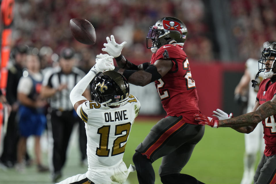 Tampa Bay Buccaneers safety Keanu Neal (22) brake up a pass intended for New Orleans Saints wide receiver Chris Olave (12) in the first half of an NFL football game in Tampa, Fla., Monday, Dec. 5, 2022. (AP Photo/Chris O'Meara)