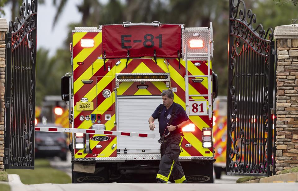 First responders work an active fire inside the Landmark Ranch Estates neighborhood on Wednesday, Jan. 3, 2024, in Southwest Ranches, Fla. Fire rescue crews alongside the Broward Sheriff's Office worked to put out a two-alarm fire at a home belonging to Miami Dolphins wide receiver Tyreek Hill inside the private neighborhood. (Matias J. Ocner/Miami Herald via AP)