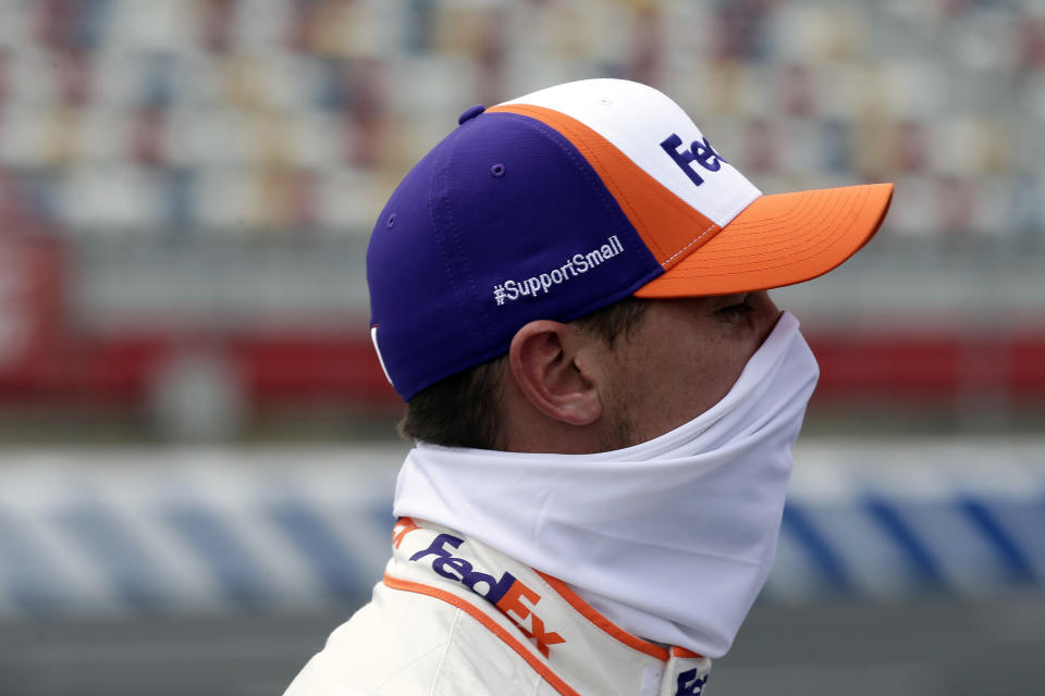 Driver Denny Hamlin waits during qualifying prior to a NASCAR Cup Series auto race at Charlotte Motor Speedway Sunday, May 24, 2020, in Concord, N.C. (AP Photo/Gerry Broome)