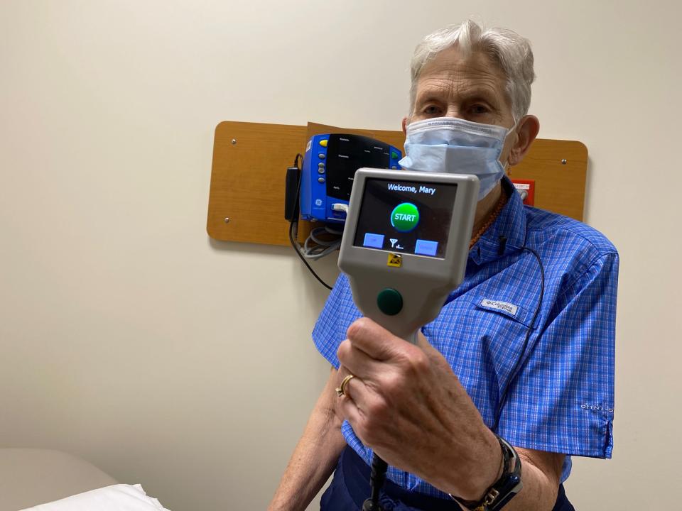 Mary Korte, 76 of Mequon, shows the device she uses to manage her heart failure. Every morning, she uses the machine to send the implant's various readings to her nurses at Aurora St. Luke's Medical Center. If anything seems off, they call her to adjust her medications.