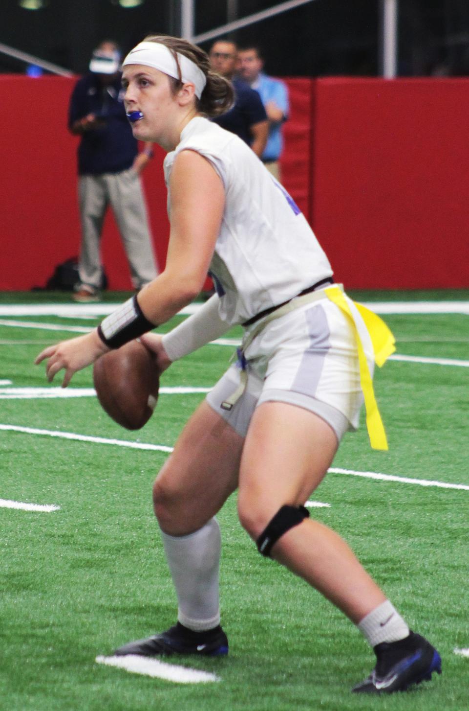 Wellington QB Keelin Coleman looks to pass against Tampa's Lennard High School. Lennard, won the game at the Tampa Bay Buccaneers indoor training facility, Friday night.