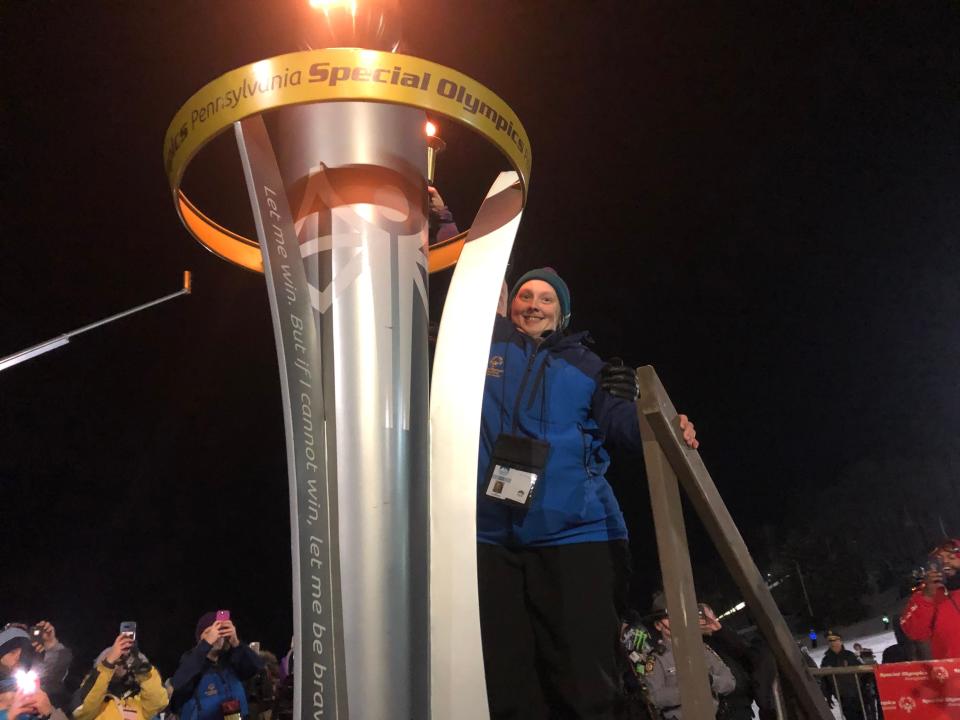 A Special Olympics athlete lights the Olympic cauldron at the 2020 Pennsylvania Winter Games at Seven Springs Mountain Resort. The Games return to Seven Springs starting Tuesday.