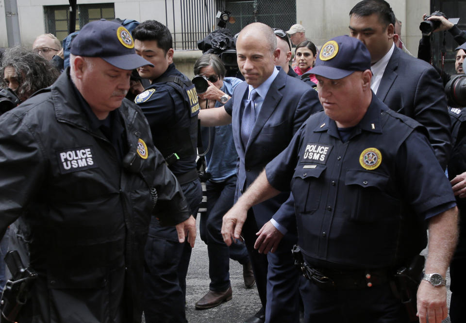 Michael Avenatti, center, surrounded by media and security, enters a courthouse in New York, Tuesday, May 28, 2019, for a hearing where he pleaded not guilty to charges that he defrauded his most famous client, porn star Stormy Daniels. (AP Photo/Seth Wenig)