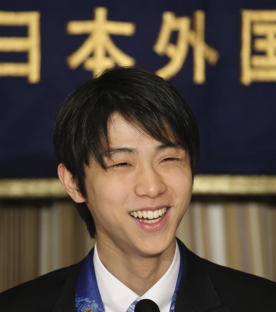 Sochi Winter Olympics men's figure skating gold medalist Yuzuru Hanyu smiles during a press conference at the Foreign Correspondents' Club of Japan in Tokyo Thursday, April 24, 2014. After winning just about everything there was to win in 2014, Japanese skater Hanyu says there is still room for improvement as he prepares for another season. (AP Photo/Koji Sasahara)