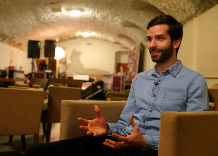 Andras Fekete-Gyor, leader of political movement Momentum which challenges Budapest's 2024 Olympic bid with a referendum, speaks during an interview with Reuters at Momentum's headquarters, located in a basement in Budapest, Hungary, February 20, 2017. REUTERS/Laszlo Balogh