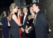 <p>At the London premiere of <em>Apollo 13, </em>Rita Wilson wore a chic black velvet evening gown, while Tom Hanks chose a black tuxedo. The film's director, Ron Howard, looked on.<br></p>