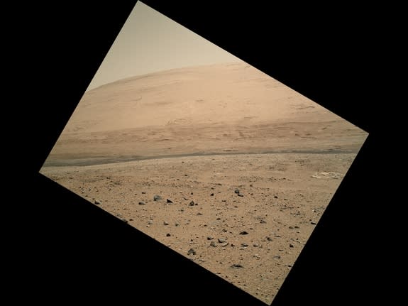 This image captured by Curiosity's Mars Hand Lens Imager camera looks toward the south, showing a portion of Mount Sharp and a band of dark dunes in front of the mountain. The photo was taken on the 340th Martian day, or sol, of Curiosity's wor