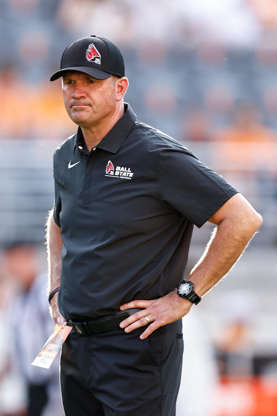 Ball State head coach Mike Neu watches as his team warms up before the game against Tennessee on Sept. 1, 2022, in Knoxville, Tennessee.