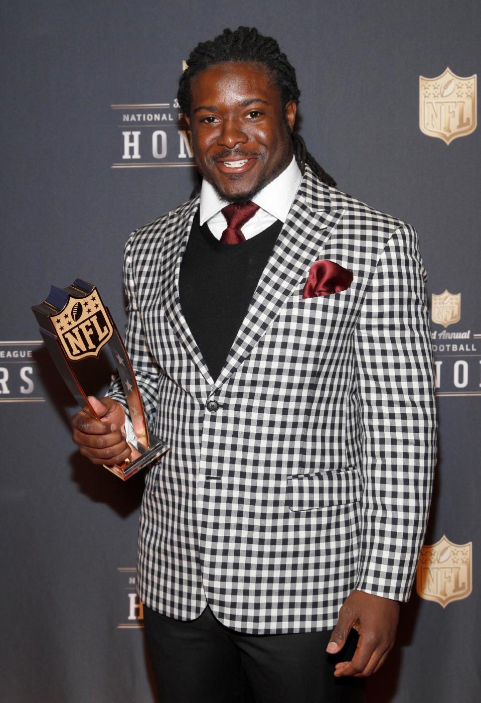 Eddie Lacy of the Green Bay Packers poses with his AP Offensive Rookie of the Year award at the third annual NFL Honors at Radio City Music Hall on Saturday, Feb. 1, 2014, in New York. (Photo by Mark Von Holden/Invision for NFL/AP Images)