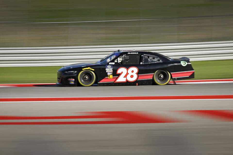 Kaz Grala steers through turn 2 during qualifying for the Focused Health 250 NASCAR Xfinity Series Race on Friday, March 22, 2024, at Circuit of the Americas race track in Austin, Texas. (AP Photo/Darren Abate)