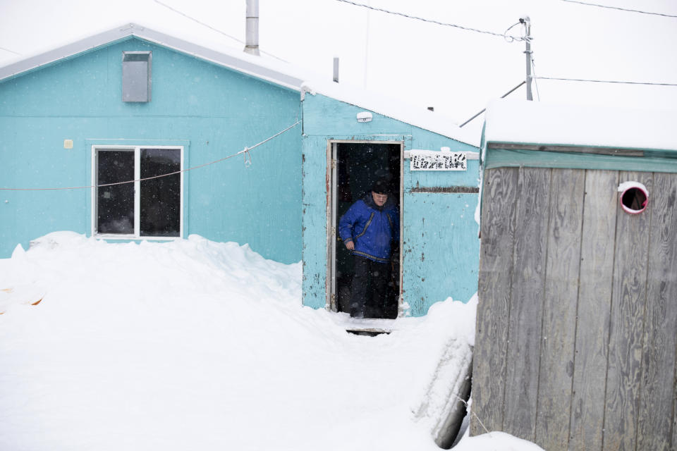 Census bureau director Steven Dillingham leaves a house after conducting the first enumeration of the 2020 Census Tuesday, Jan. 21, 2020, in Toksook Bay, Alaska. (AP Photo/Gregory Bull)