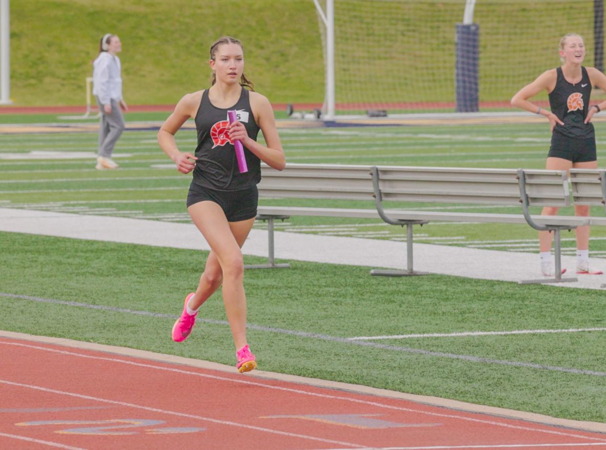 Berkley Holtz heads to the finish line for Sturgis in the two-mile relay on Tuesday.