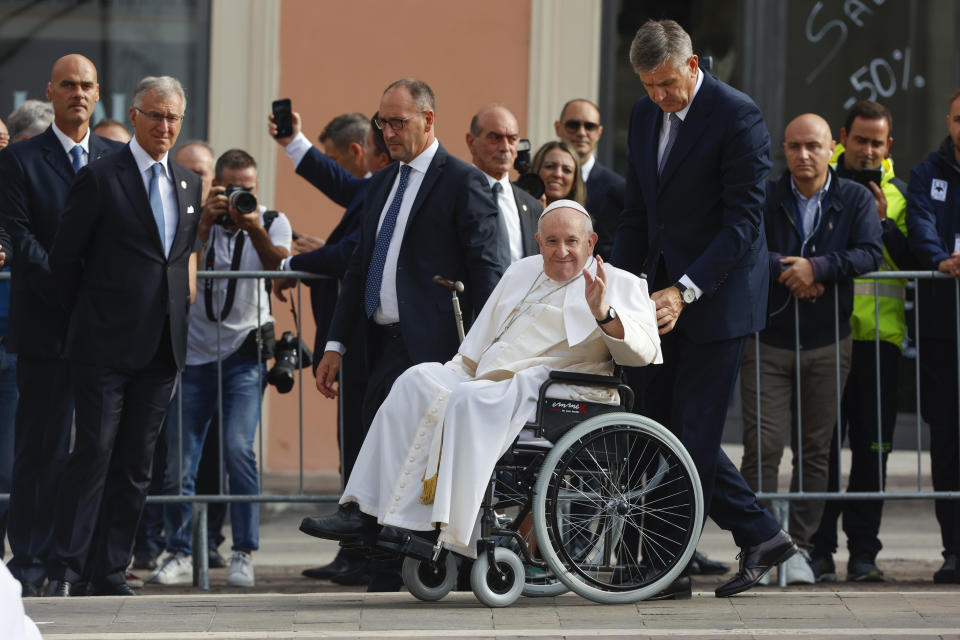 Pope Francis arrives for a meeting with relatives of the victims of the 2009 earthquake, in L'Aquila, central Italy, Sunday, Aug. 28, 2022. Pope Francis is on a one-day visit to L'Aquila to open the Holy Door of St. Mary in Collemaggio Basilica and start the jubilee of forgiveness. (AP Photo/Riccardo De Luca)