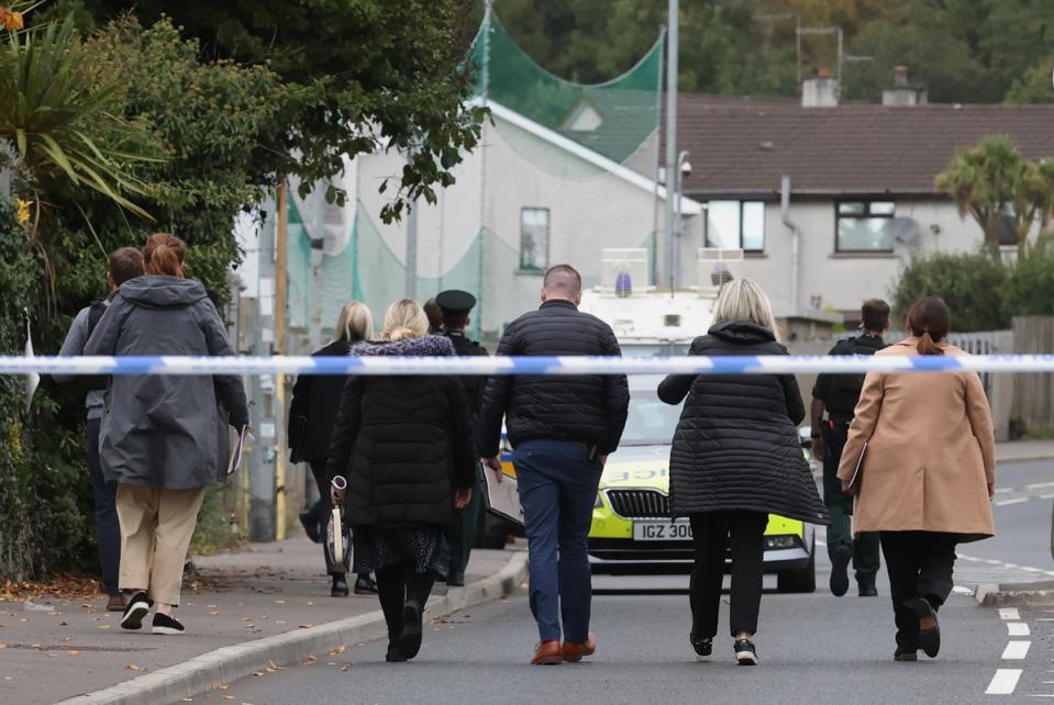 PSNI detectives arrive at the scene following a shooting at the clubhouse of Donegal Celtic Football Club (PA)