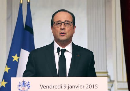 French President Francois Hollande addresses the nation at the Elysee Palace in Paris January 9, 2015. REUTERS/Remy de la Mauviniere/Pool