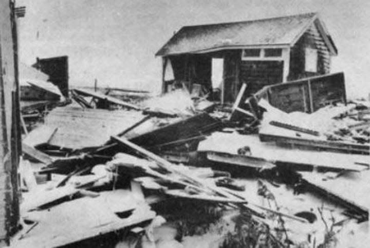 Splintered wreckage littered the parking lot and Ocean Boulevard at North Hampton's public beach following the Blizzard of 1978. These are former fishing shacks used as summer homes and bath houses.