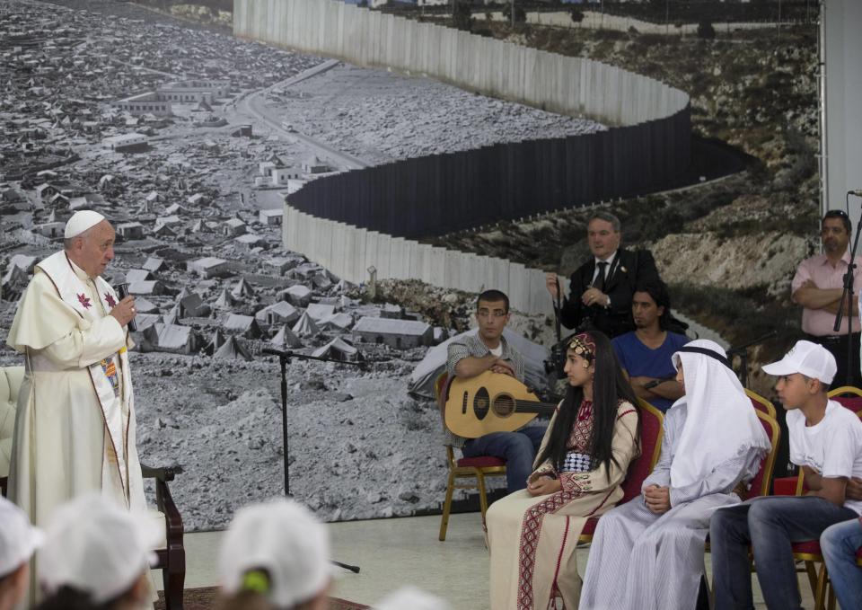 Pope Francis talks during a meeting in the Phoenix Center of the Dheisheh refugee camp, near Bethlehem