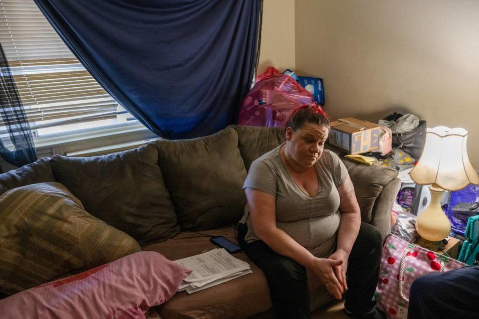 Kristi Phillips, 49, who has been waiting for a Section 8 housing voucher for 14 years, sits in a friend’s Sacramento apartment in August. After receiving an eviction notice, her friend had vacated the space but Phillips and her son were still living there. “I’m at a loss for words,” said Phillips, who had no idea where she would go next because rent is so expensive. She said she lost her job after her car broke down and she had no transportation.