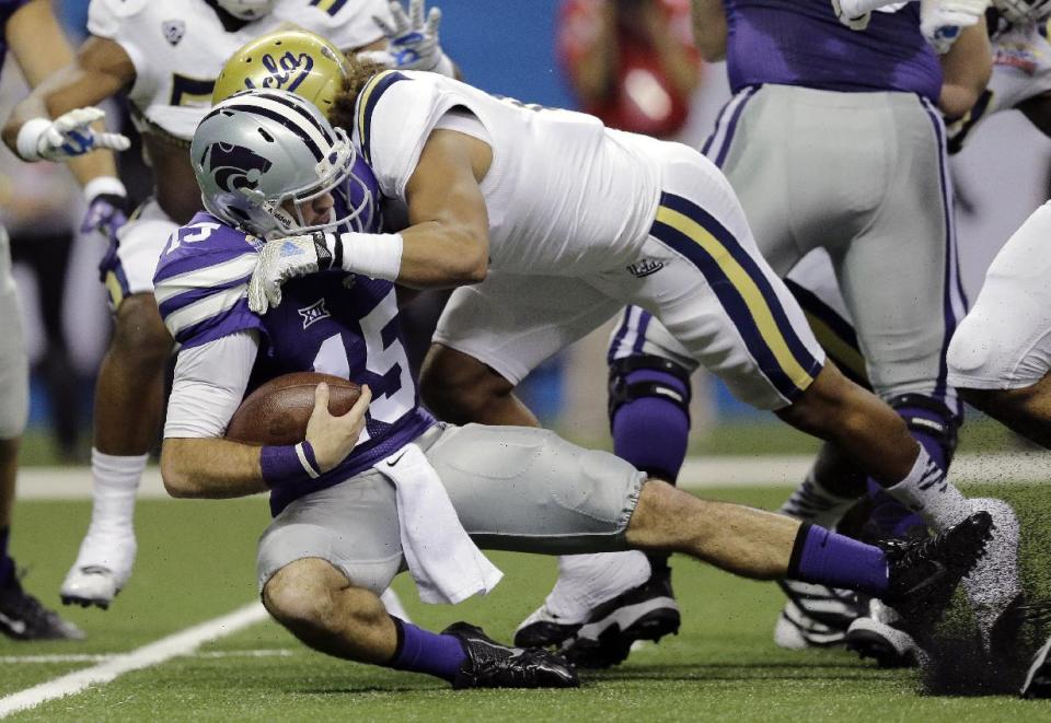 Kansas State&#39;s Jake Waters (15) is sacked by UCLA&#39;s Eric Kendricks (6) during the Alamo Bowl. (AP)