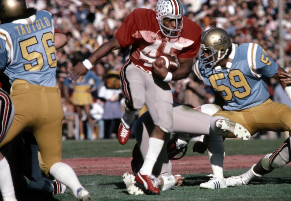 Jan 1, 1976; Pasadena, CA, USA; FILE PHOTO; Ohio State Buckeyes running back Archie Griffin (45) carries the ball against the UCLA Bruins in the 1976 Rose Bowl. UCLA defeated Ohio State 23-10. Mandatory Credit: Malcolm Emmons-USA TODAY Sports