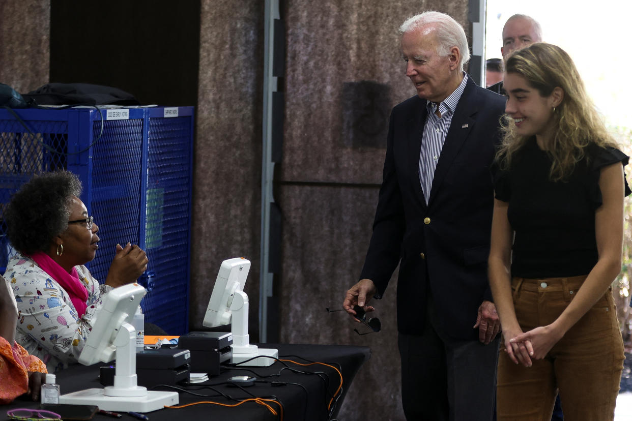 Biden and his granddaughter Natalie arrive to vote