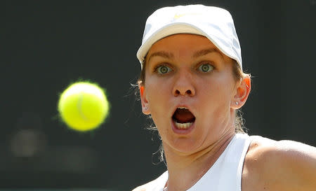 Tennis - Wimbledon - All England Lawn Tennis and Croquet Club, London, Britain - July 7, 2018. Romania's Simona Halep hits a shot during her third round match against Taiwan's Su-Wei Hsieh. REUTERS/Peter Nicholls