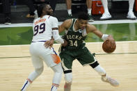 Milwaukee Bucks forward Giannis Antetokounmpo (34) drives on Phoenix Suns forward Jae Crowder (99) during the second half of Game 3 of basketball's NBA Finals in Milwaukee, Sunday, July 11, 2021. (AP Photo/Paul Sancya)