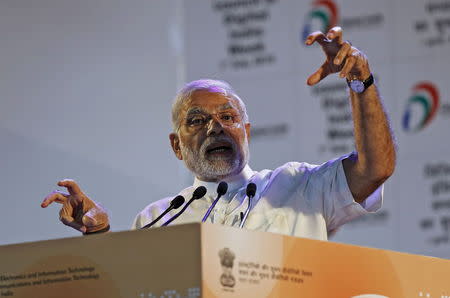 Indian Prime Minister Narendra Modi gestures while addressing the gathering during the launch of "Digital India Week" in New Delhi, India, July 1, 2015. REUTERS/Adnan Abidi