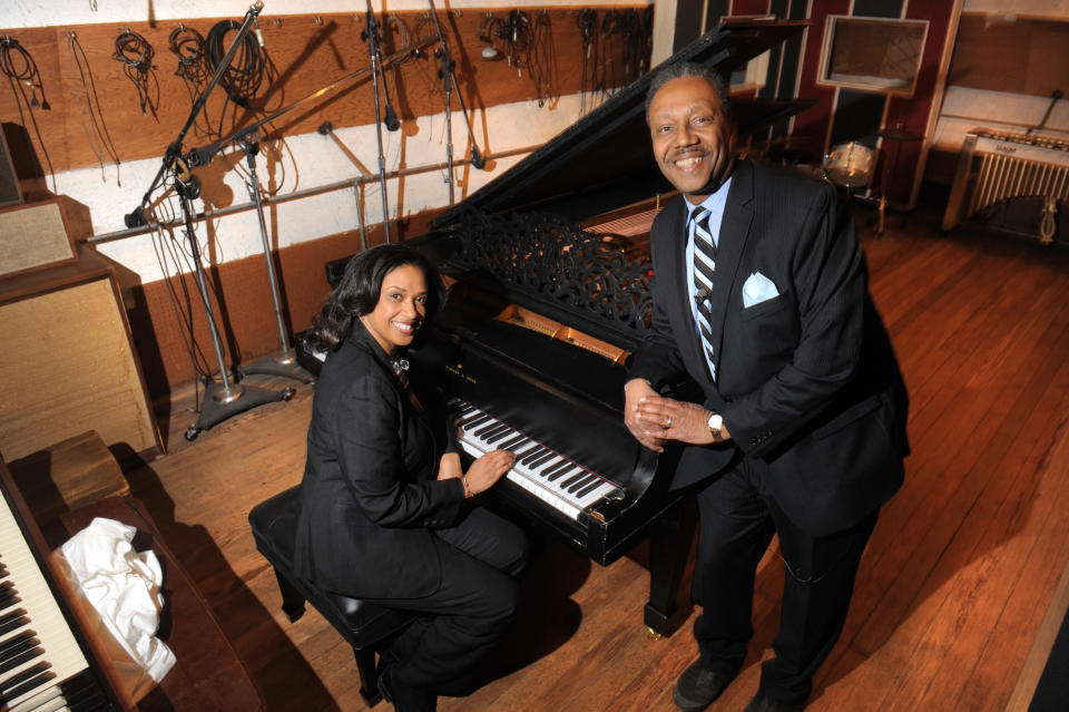 Robin R. Terry, left, Chairman of the Board of Trustees of Motown Museum, and Interim Motown Museum CEO Allen Rawls pose for a photo with the prized Steinway grand piano, Monday, April 1, 2013. The 1877 Steinway grand piano used by Motown greats during the label's 1960s heyday, and restored thanks to Paul McCartney, is back home in Detroit. (AP Photo/The Detroit News, Max Ortiz)