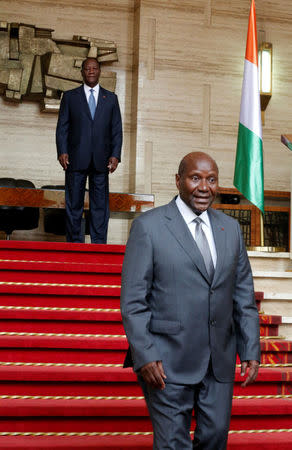 Ivory Coast Prime Minister Daniel Kablan Duncan leaves President Alassane Ouattara after announcing the resignation of his government in the Presidential Palace in Abidjan, Ivory Coast January 9, 2017. REUTERS/Thierry Gouegnon