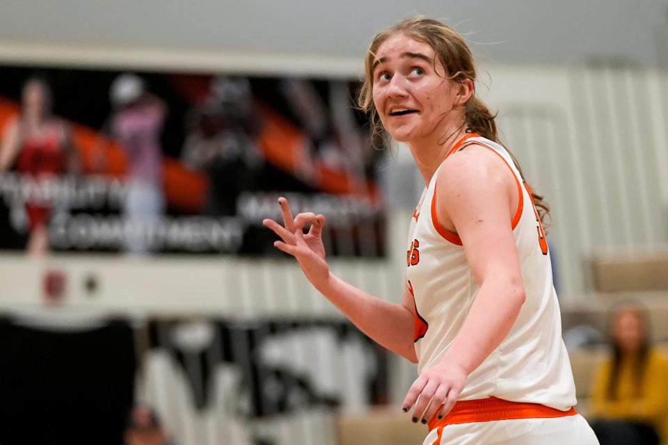 Ryle Raiders center Sarah Baker (50) celebrates after shooting a three-pointer during the girls basketball game between the Ryle Raiders and Butler Bears on Friday, Dec. 29, 2023, at Ryle High School in Union, Ky. Ryle won 44-37.