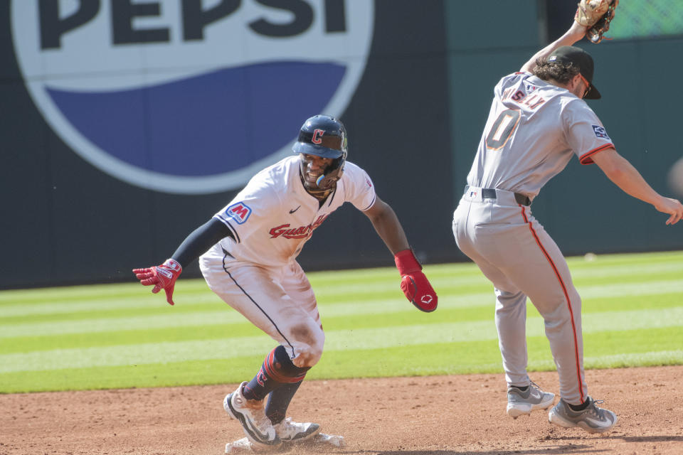 San Francisco Giants' Brett Wisely (0) forces out Cleveland Guardians' Angel Martinez, left, at second base during the second inning of a baseball game in Cleveland, Saturday, July 6, 2024. (AP Photo/Phil Long)