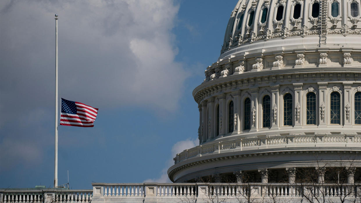 The U.S. flag flies at half mast outside the Capitol